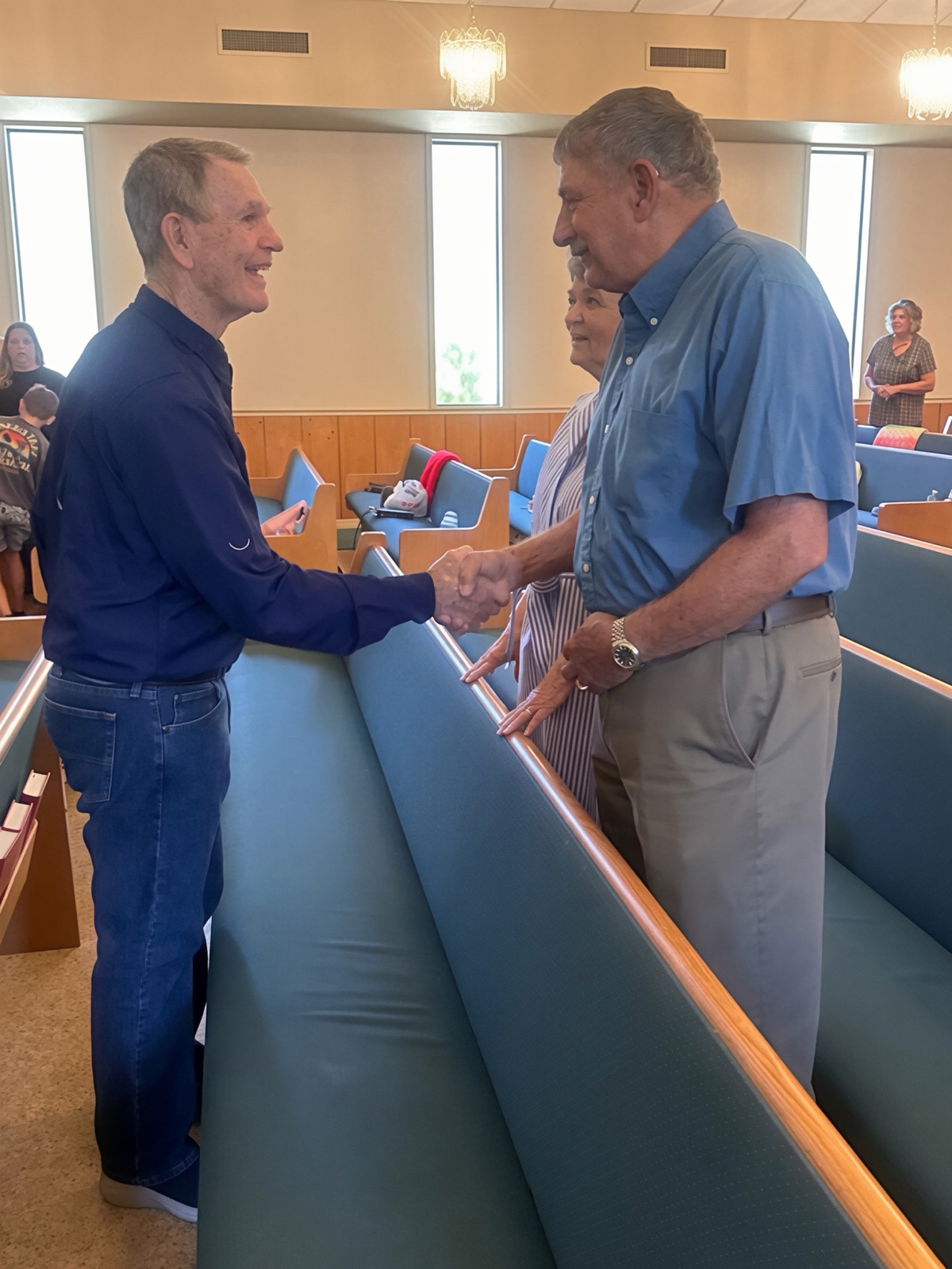 Members greeting one another across the pews at Hardeetown